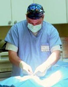 One of our veterinarian performing spay surgery